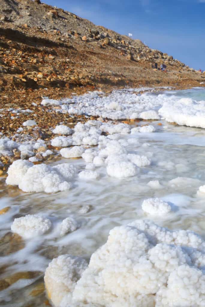 Visiting the Dead Sea: Blobs of salt formations near and on the Dead Sea beach