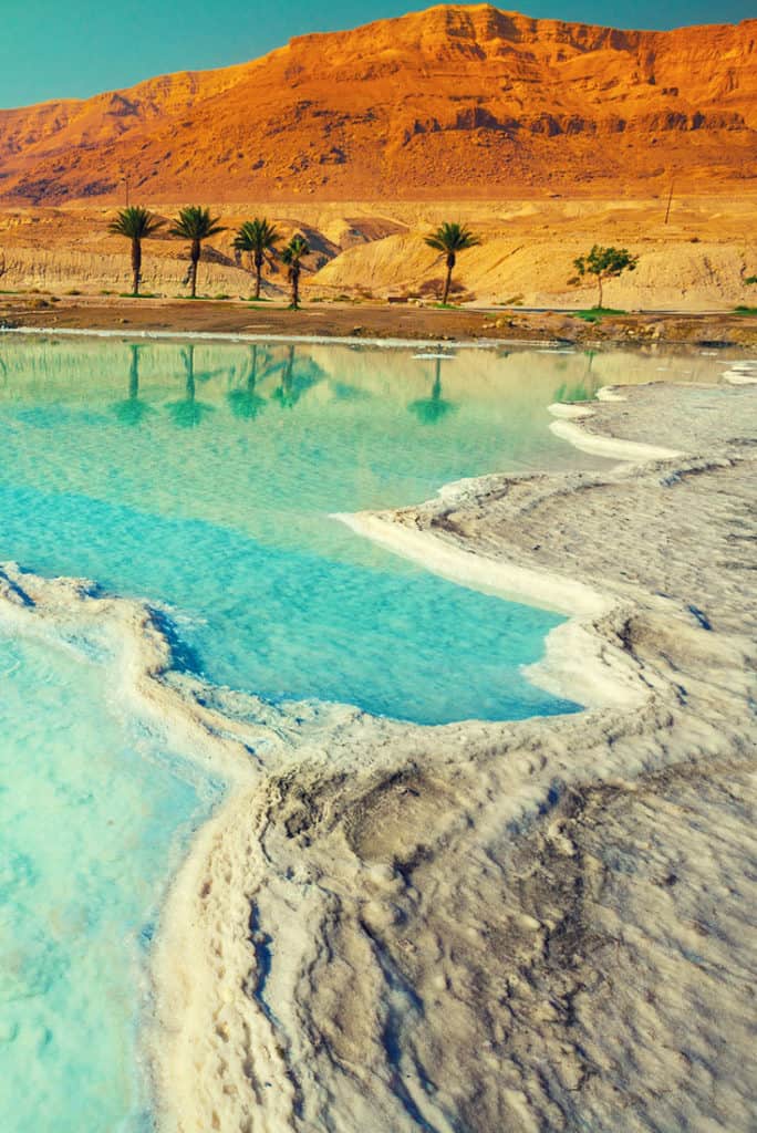 Visiting The Dead Sea - Turquoise lagoons of salt and palm trees on the beach