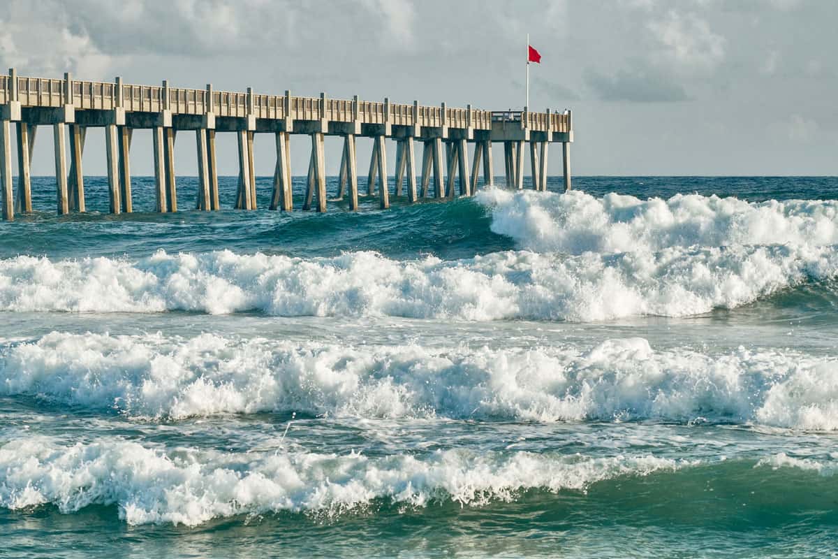 Pier and Huge waves on the beach of Pensacola, Florida