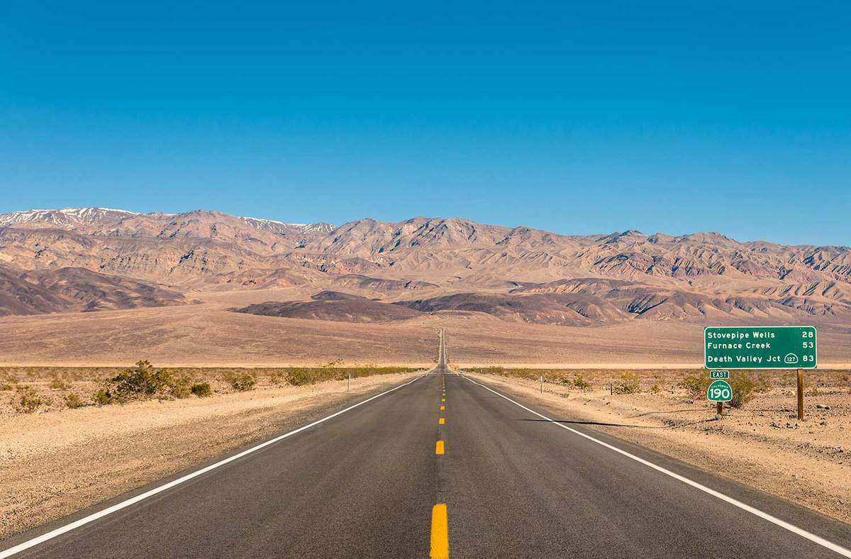 Empty infinite road in the desert of Death Valley California