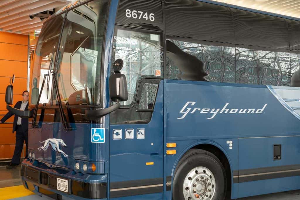 Greyhound bus with on-boarding passengers