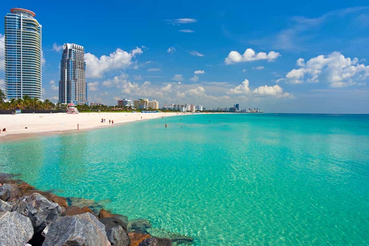 Beaches and tall buildings in Miami with clear blue oceans