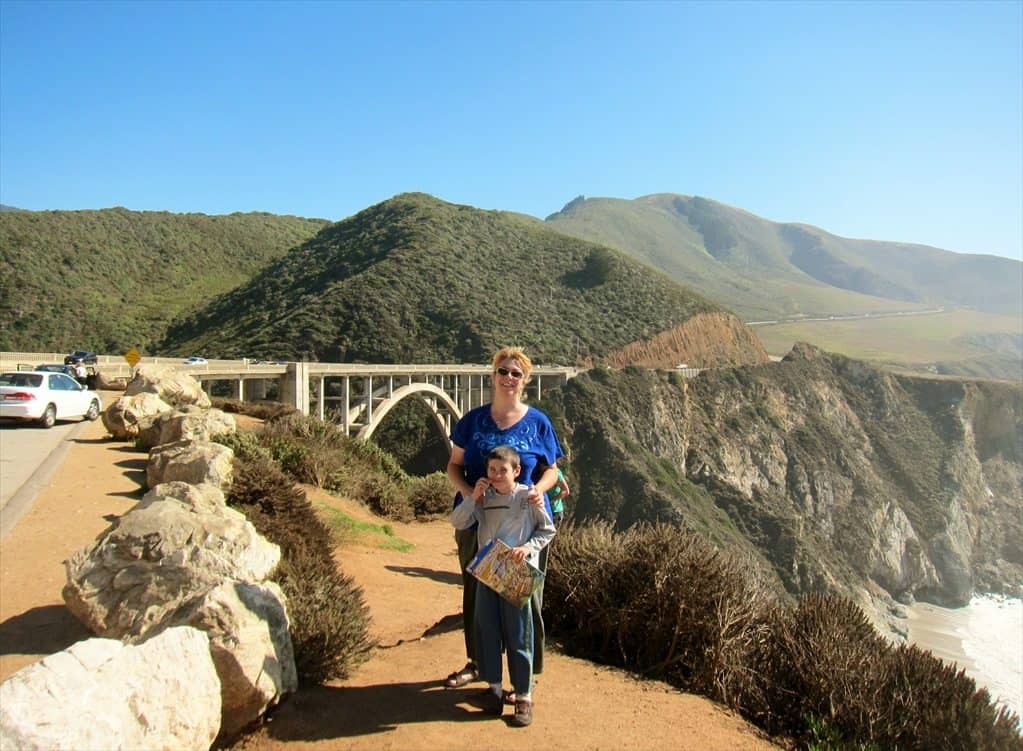 Mother and son taking picture near a bridge located in Highway 1