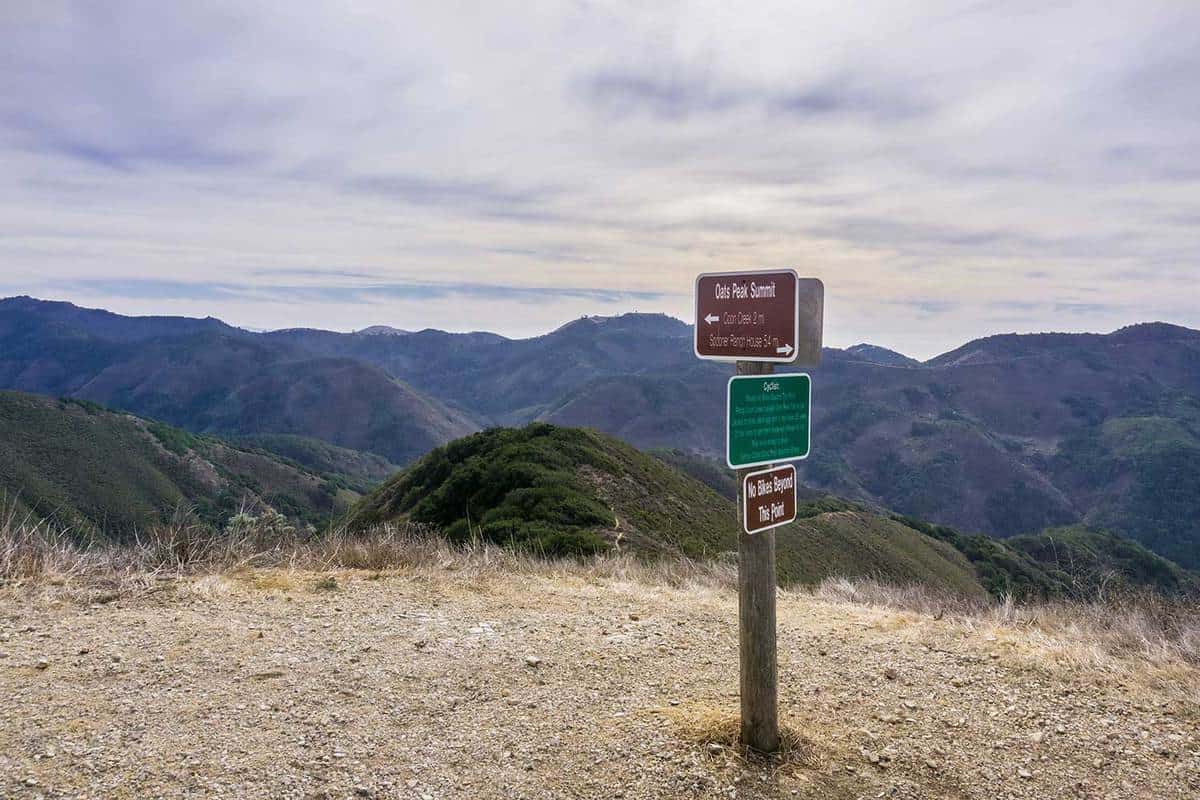 Posted signs in Montana de Oro State Park placed on Oats Peak, one of the highest in the park