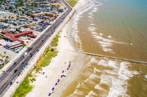 Aerial view of Galveston, Texas sea wall and beach, Are Texas Beaches Warm In December?