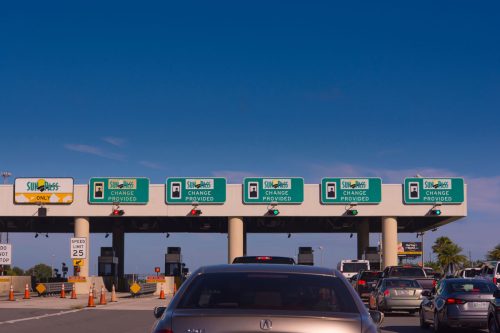 A busy toll fee area at a Florida Express way, How To Pay Tolls When Visiting Florida