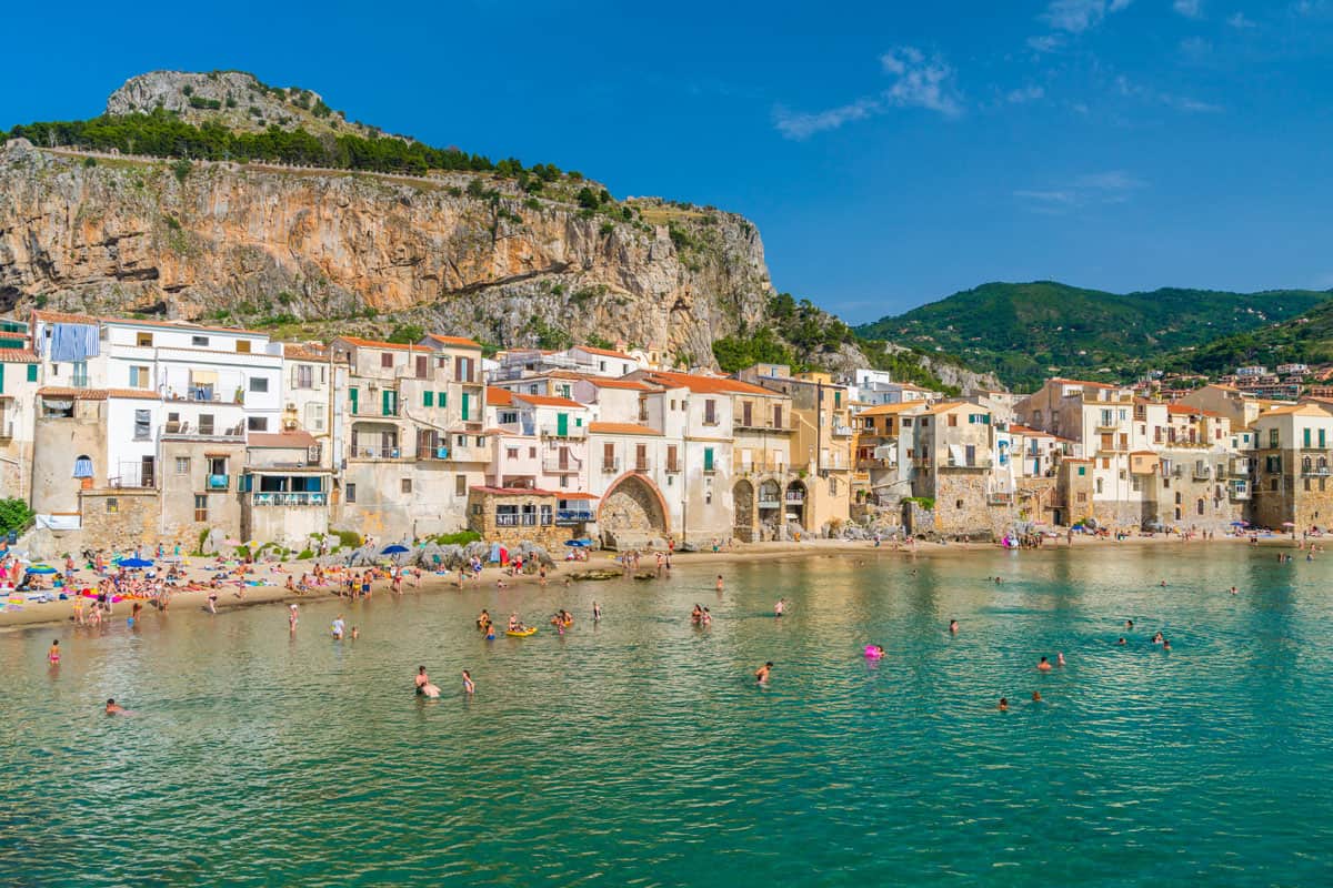 The picturesque Cefalù waterfront on a sunny summer day. Sicily, southern Italy.