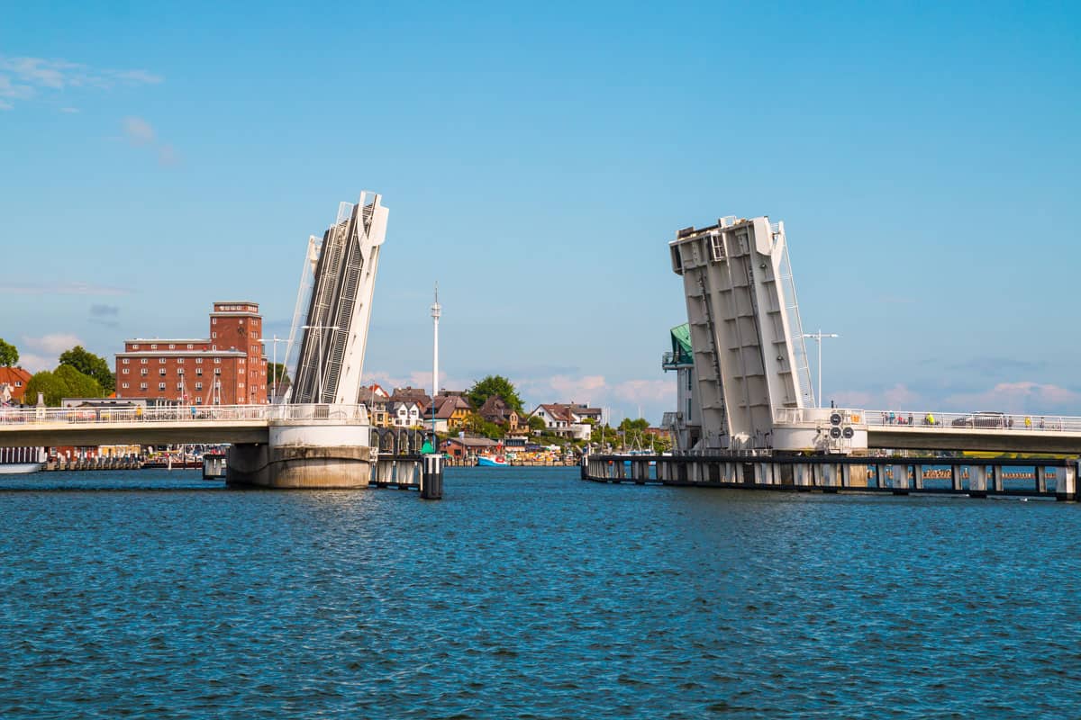 Open drawbridge in Kappeln with buildings photographed from a distance