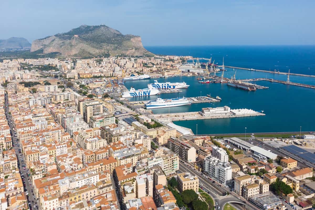 Aerial view of GNV ferry boats that are anchored at the Palermo harbor in the largest city in Sicily by the Mediterranean sea