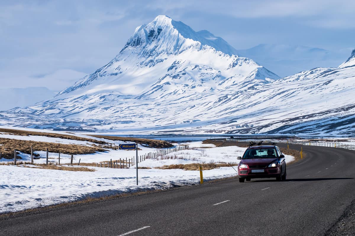 Car cruising down the highway in Iceland