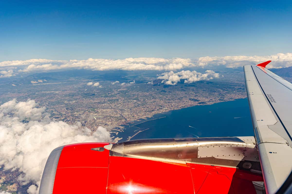 The gulf of Naples seen from above from an airplane, How to Go From Naples to Sicily [Travel Tips]