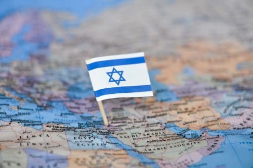 Map with flag of Israel close up point at the country of Israel, Will My Phone Work In Israel When Visiting From The US?