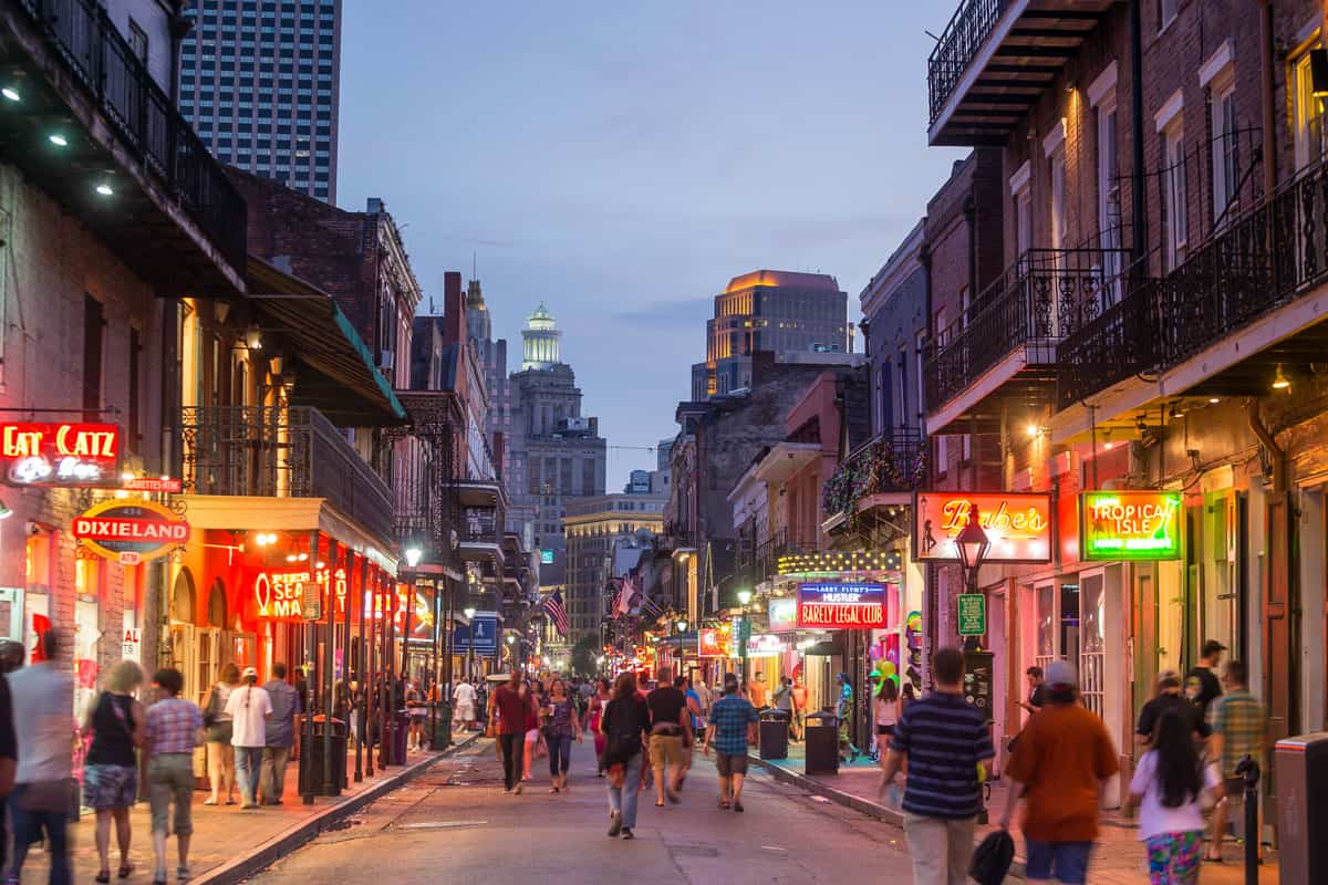 People walking down the busy streets of New Orleans, Ghostly Getaways: Uncover The Most Haunted Places In New Orleans