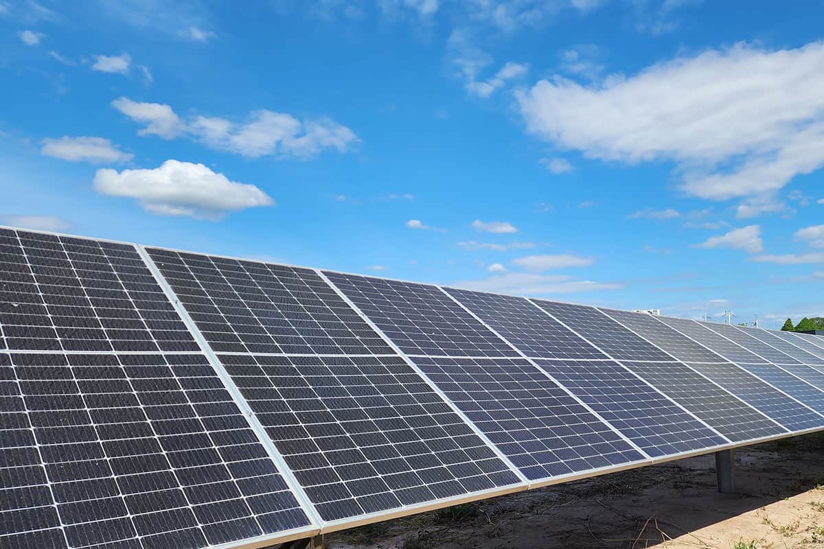 Solar panels installed against blue sky background