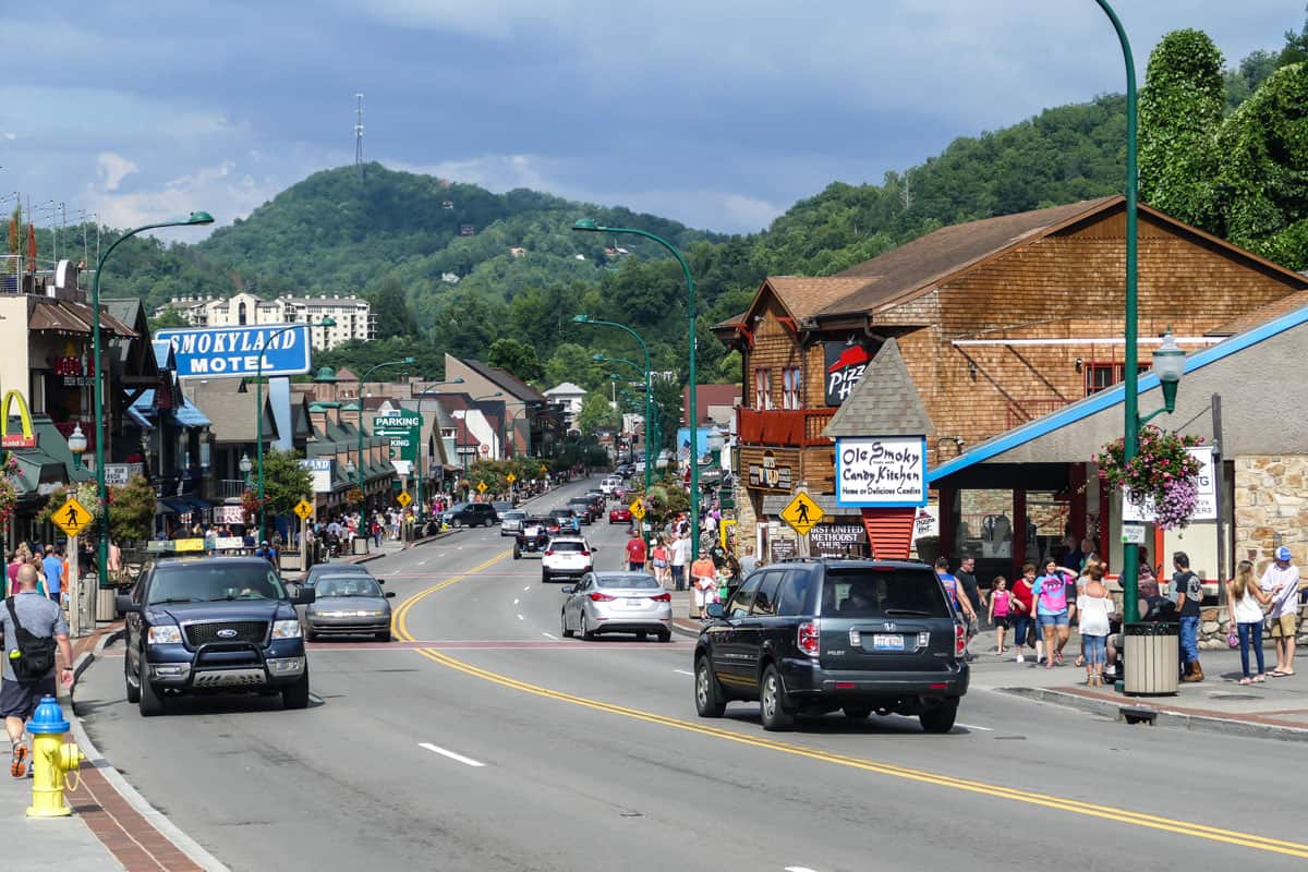 The busy streets of a Gatlinburg, Tennessee with lots of tourist walking around town