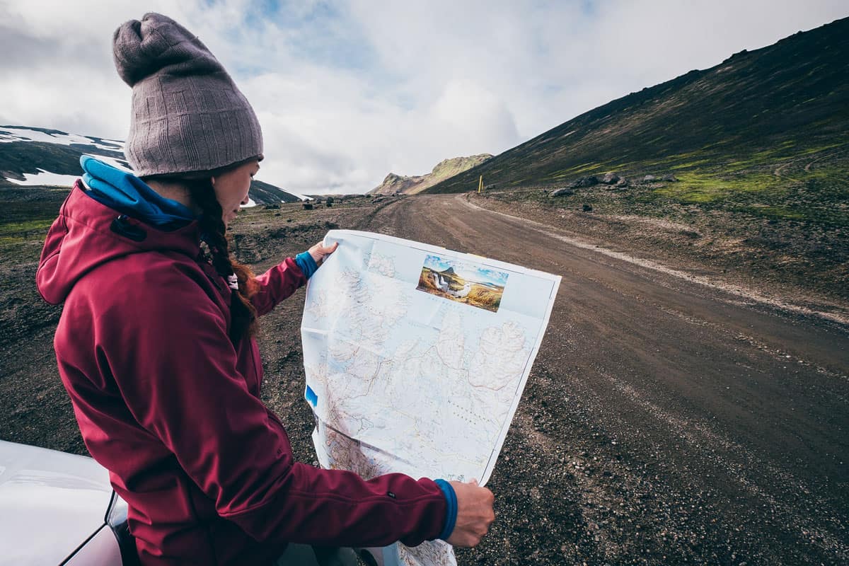 Tourist checking the map before driving through iceland