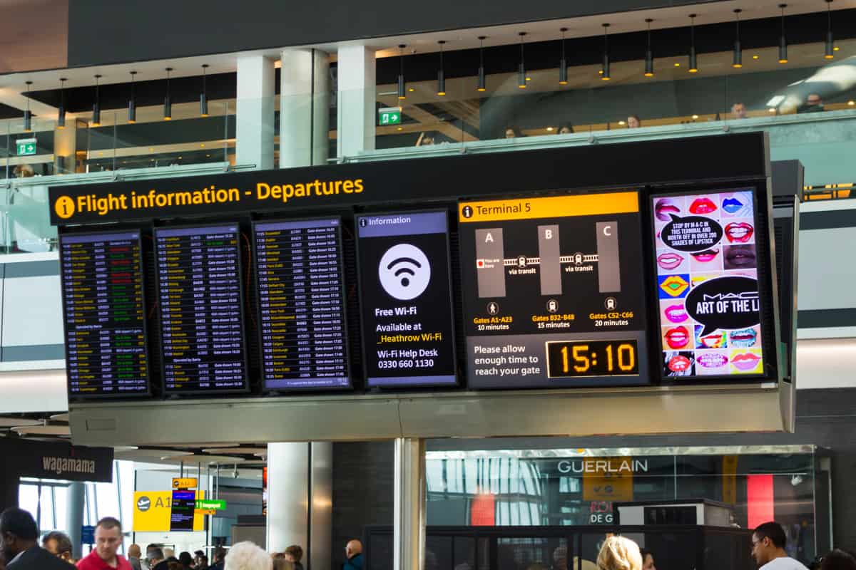 A large flight information digital display board at Terminal 5 departures in Heathrow Airp