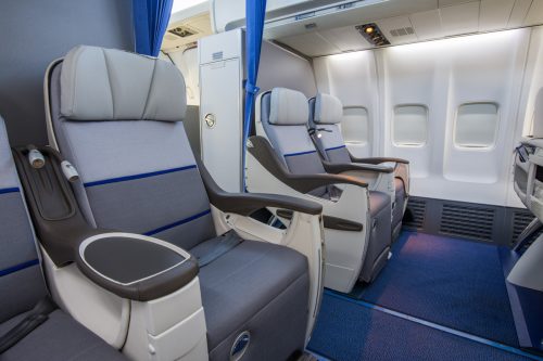 Airplane cabin business class interior view, From Takeoff to Touchdown: How to Stay Comfortable on Long Flights