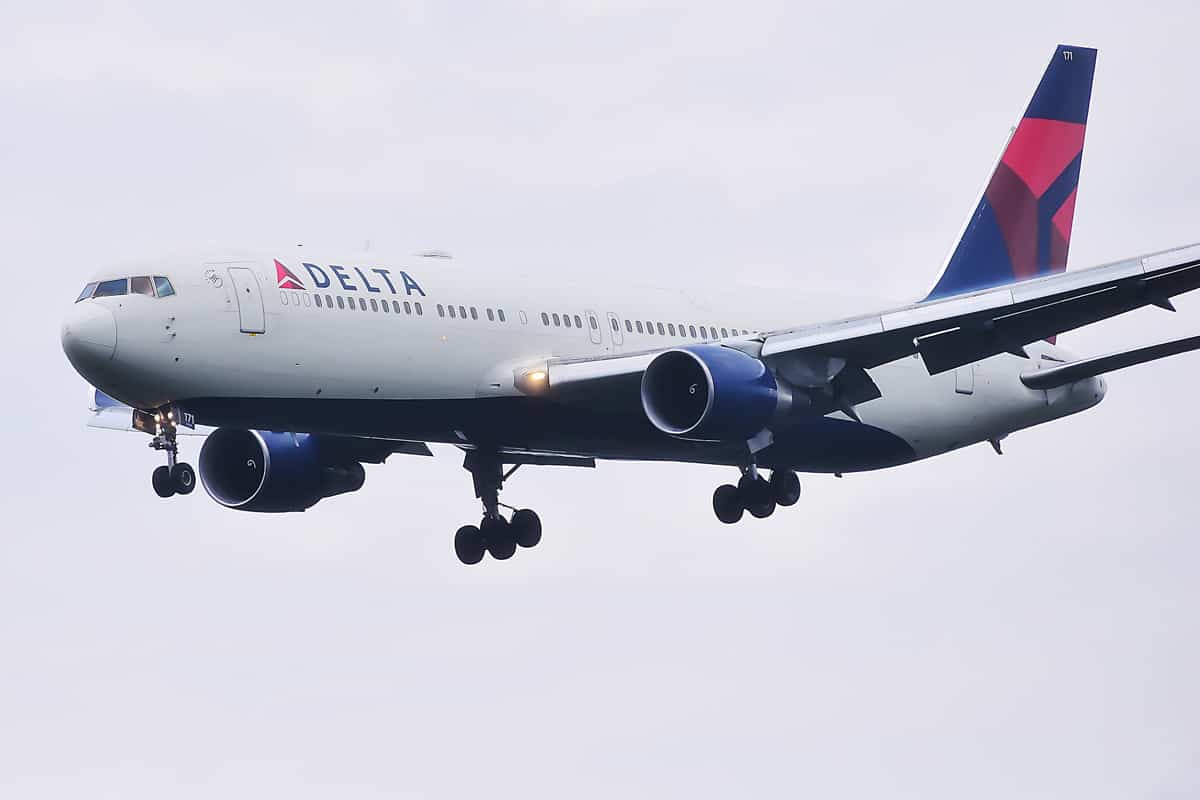 Delta Air Lines aircraft over airport