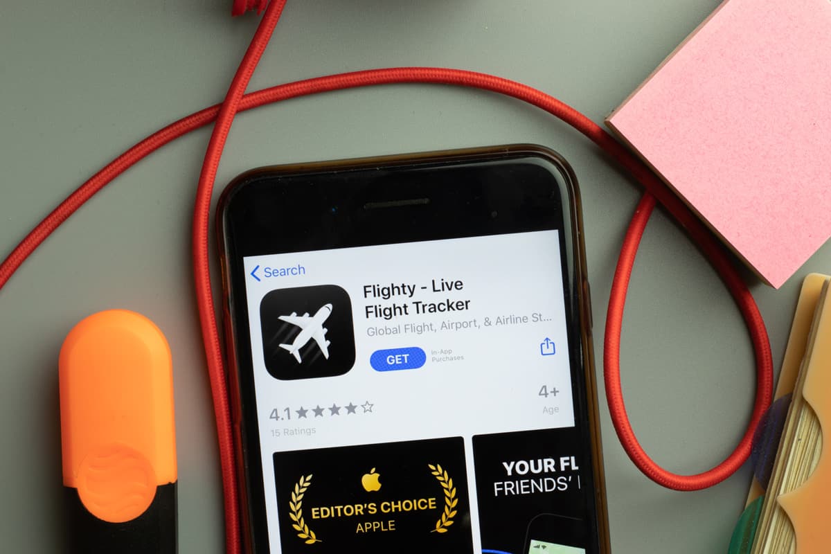 Flighty Live Flight Tracker app store logo on phone screen, Illustrative Editorial