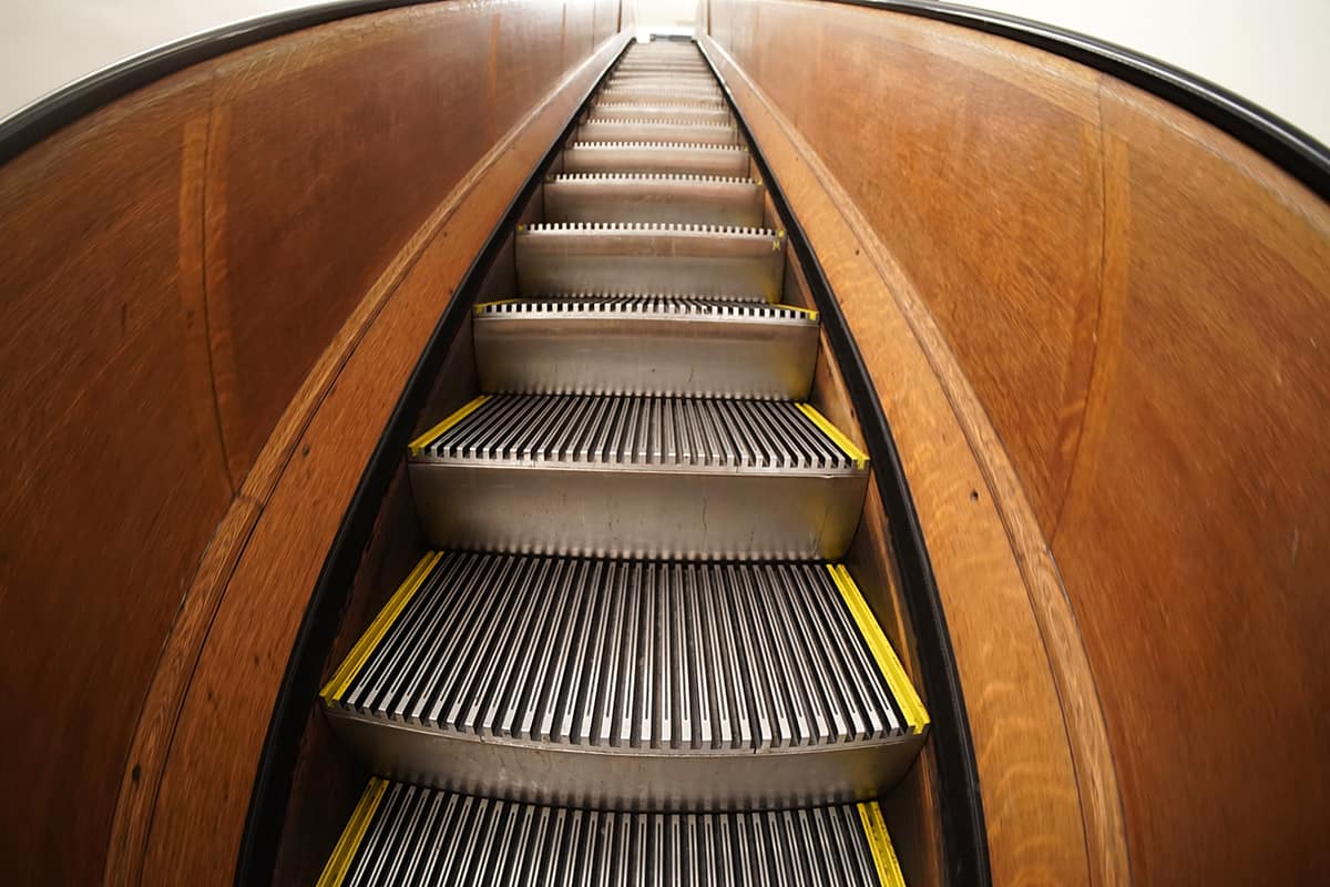 Old antique wooden escalator in new york city mall