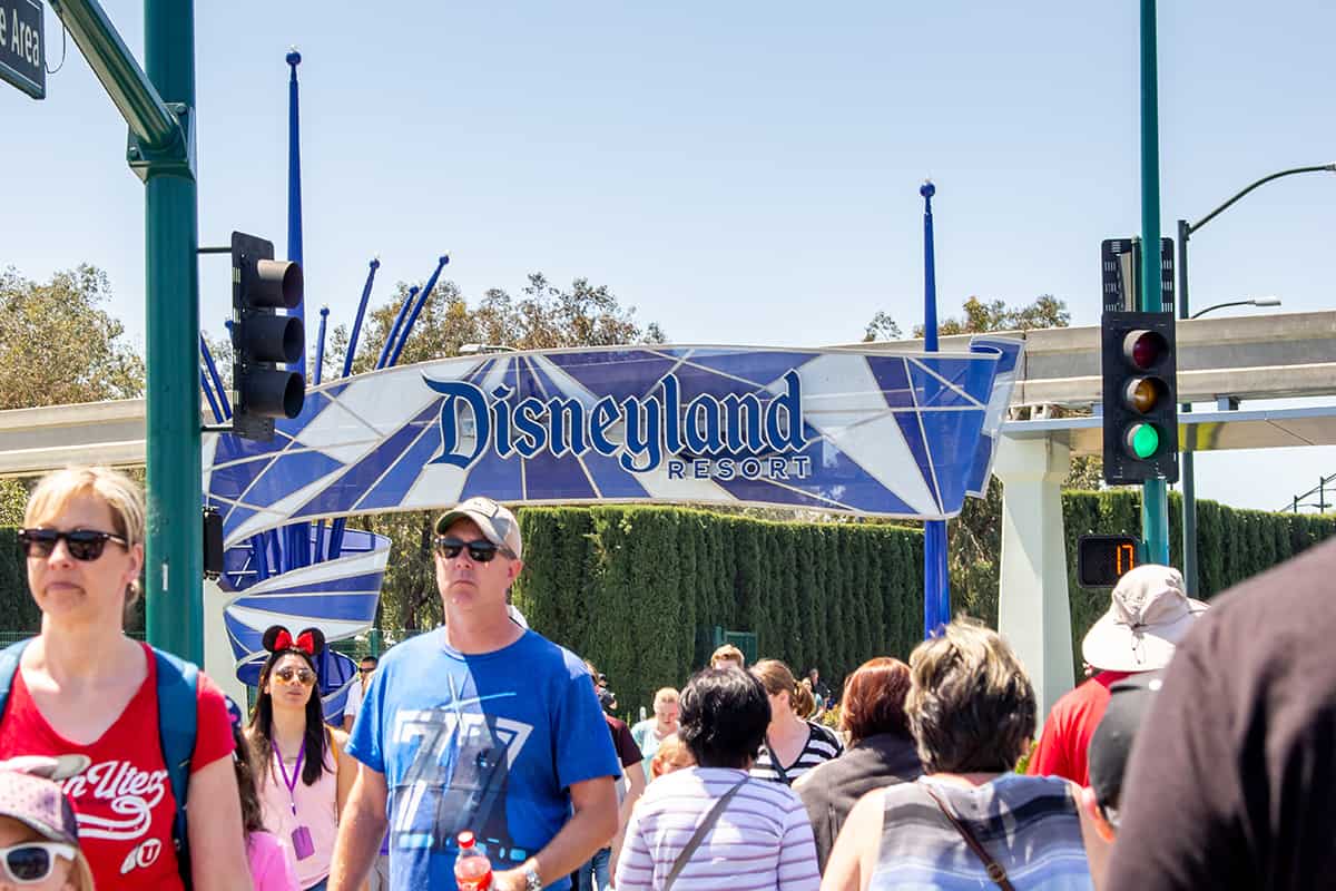Tourist walk across the street towards disneyland theme park, Disneyland Goes All Out For 100th Birthday Bash!