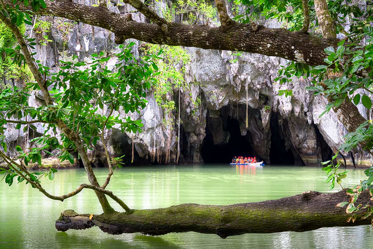 Visitors on a boat at the Subterranean River in Puerto Princessa