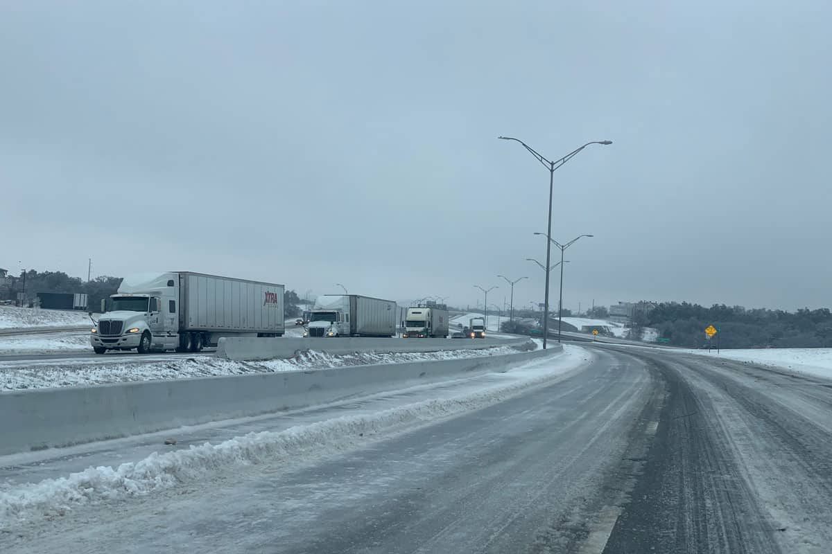 semi-trucks on interstate highway IH35 during cold freezing storm, Rescuing Stranded Drivers During An Ice Storm Texas Realtor Turns Hero