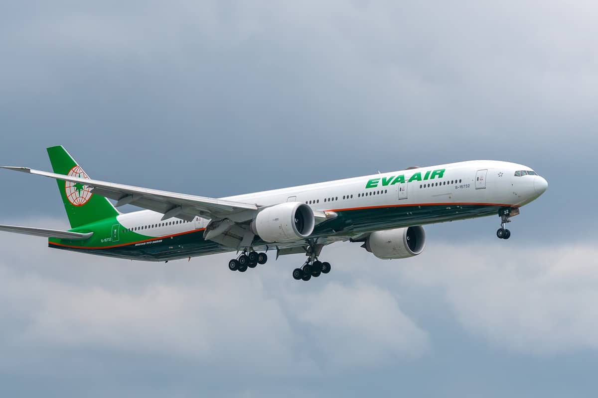 777 of Eva Air fly over urban areas prepare to landing at Tan Son Nhat International Airport