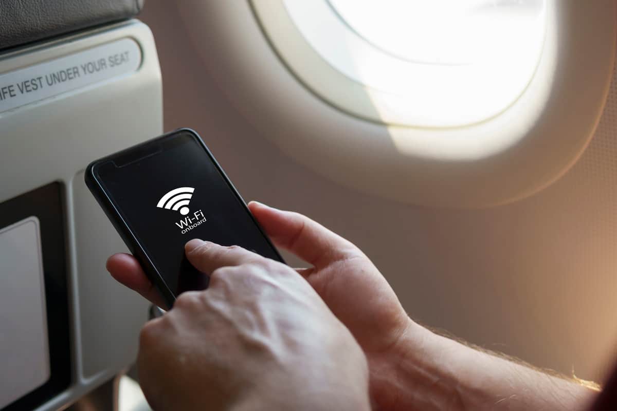 Man accessing the Wi-Fi on board the airplane
