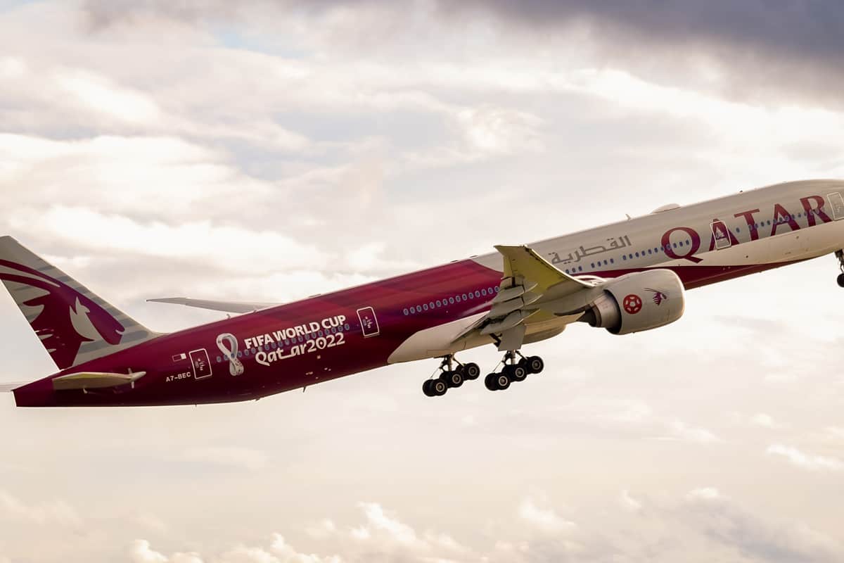 Qatar Airways Boeing 777-300ER (A7-BEC 'FIFA World Cup Qatar 2022') departing from Manchester Airport