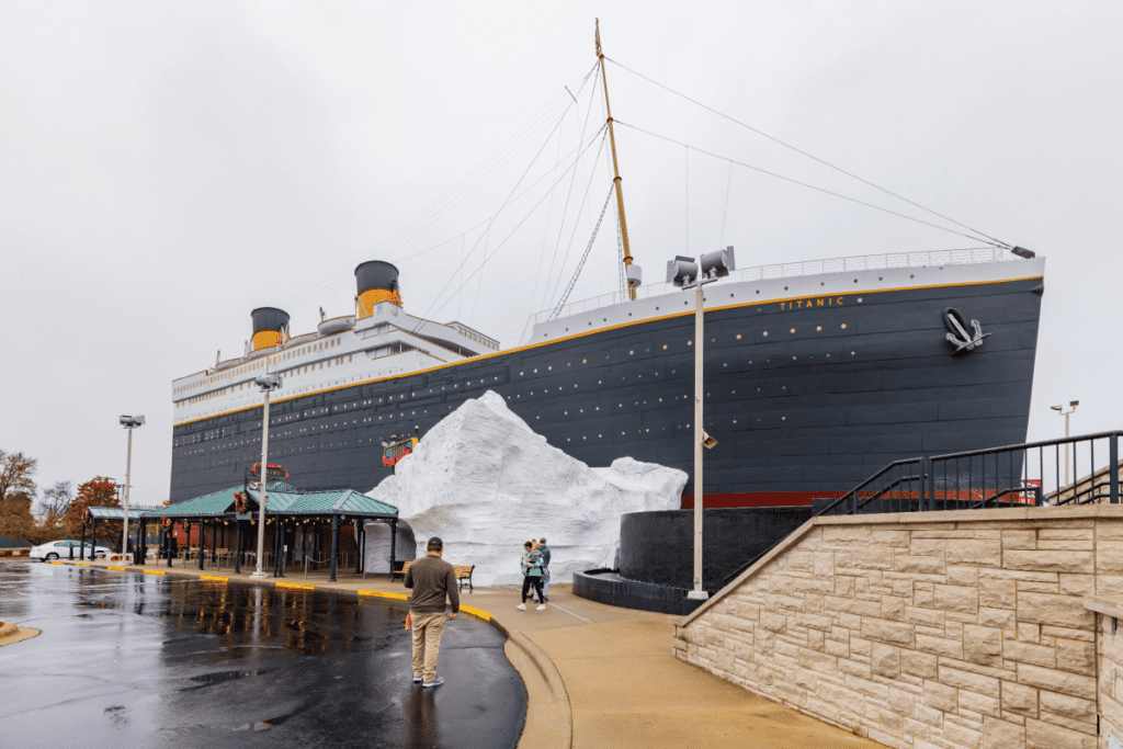 Exterior image of the Titanic Museum in Branson Missouri. The photo shows the entrance to the boat and the iceburg outside.