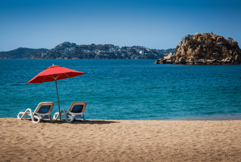 Beach chairs on a beautiful, serene beach in acapulco