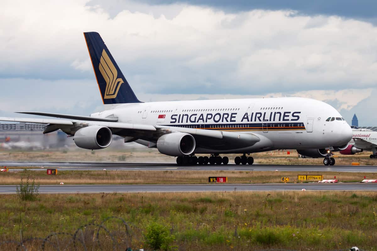 Singapore Airlines passenger plane at airport. Schedule flight travel. Aviation and aircraft.
