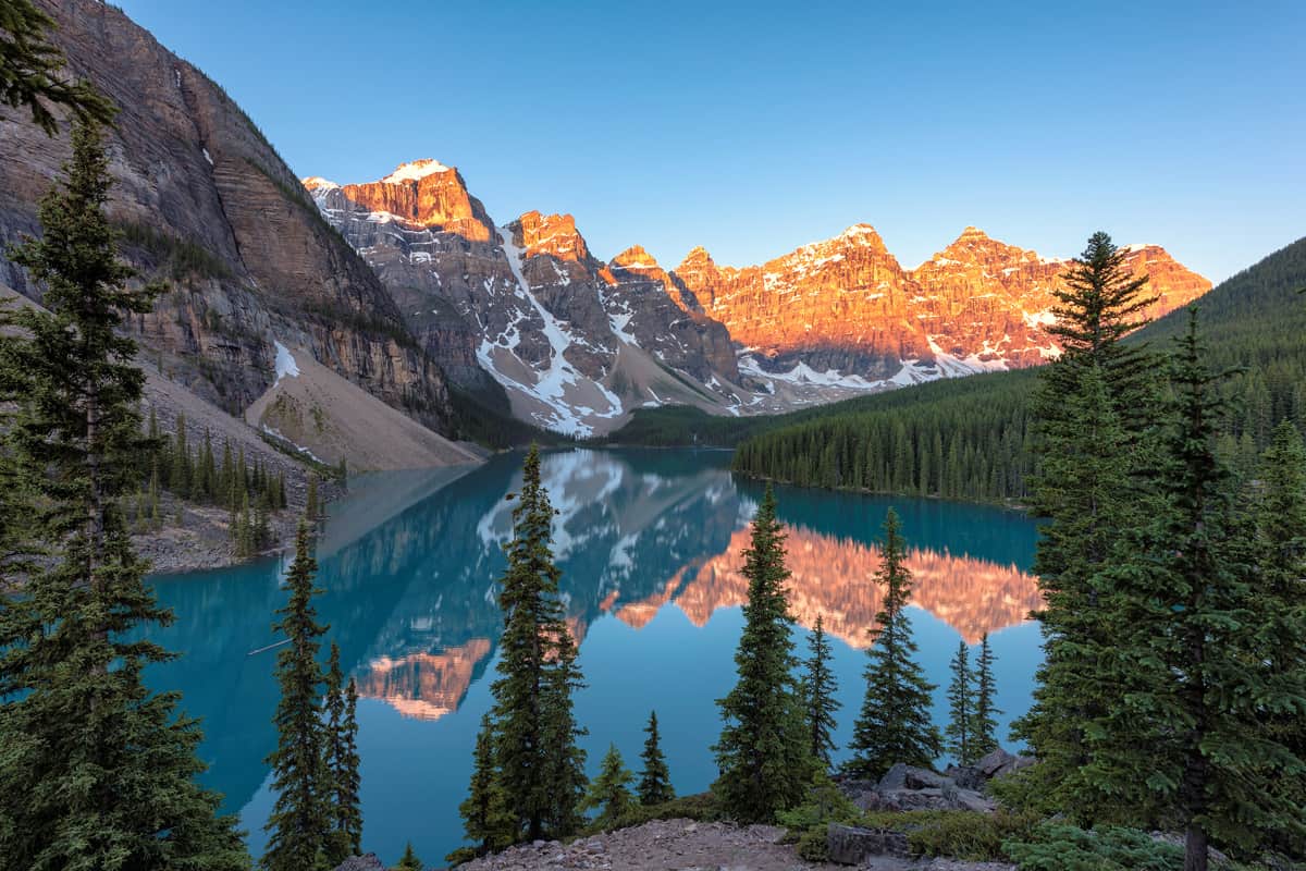 Turquoise waters of Lake Moraine photographed with the early morning daylight
