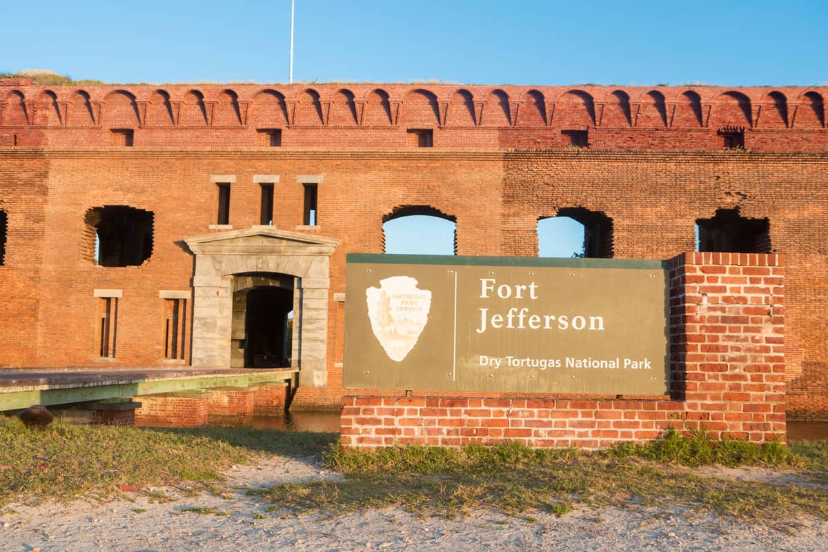 A sign showing Fort Jefferson with the Fort right behind the sign