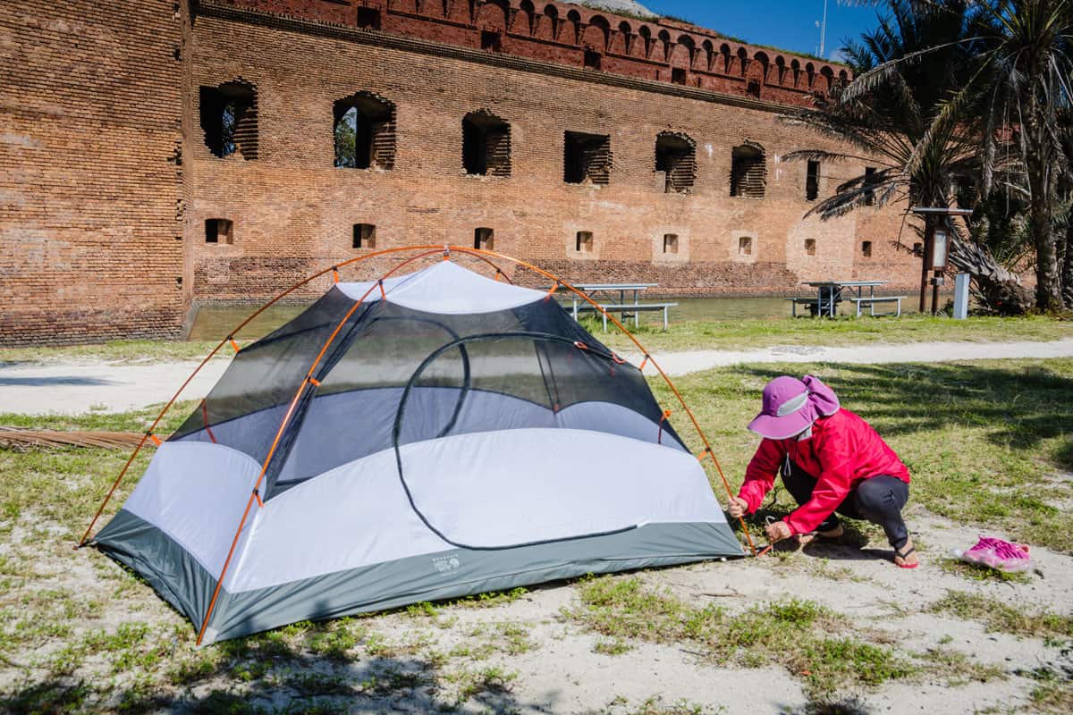 Man setting up tent near the Fort of Dry Tortugas National Park