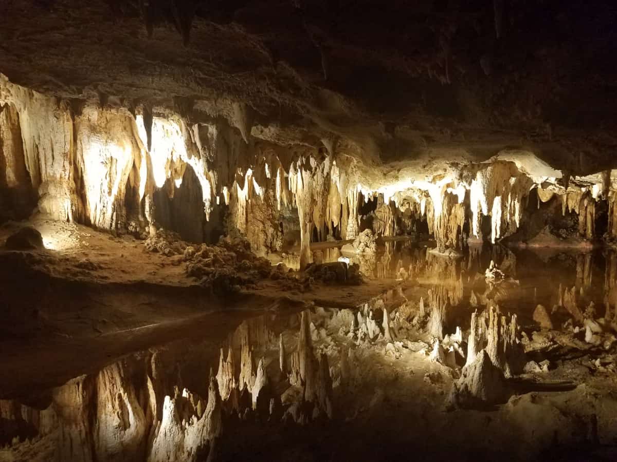 brown stalactites and stalagmites in cave