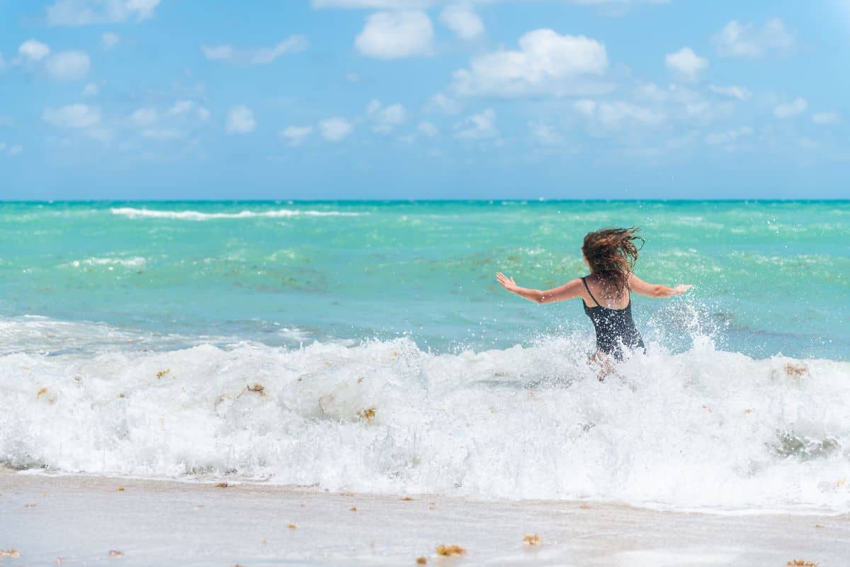 Woman entering the ocean in Florida