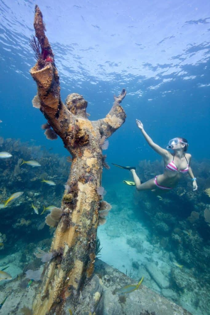 Diver with the statue of Jesus of the Abyss, Florida