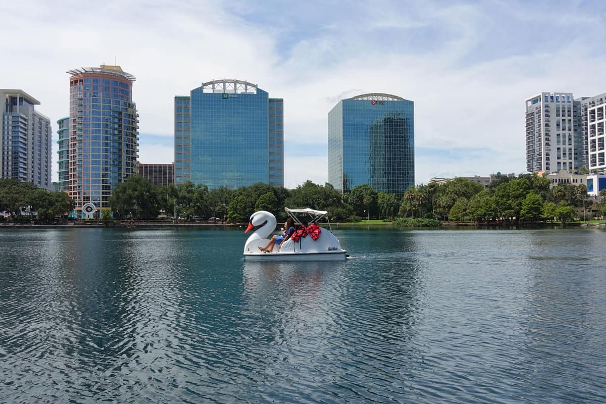 People riding a tourist duck water ride in Lake Eola Park