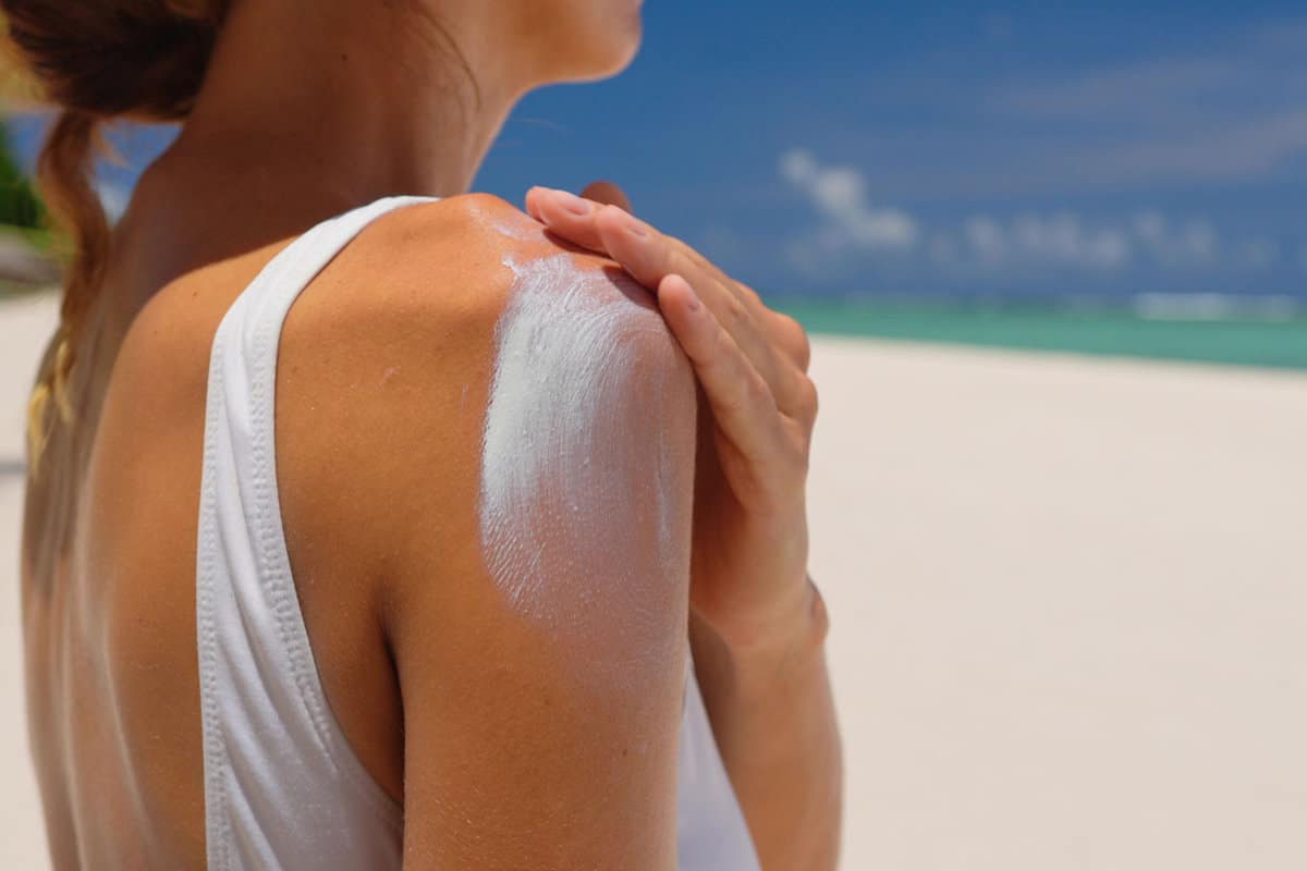 Applying suntan lotion