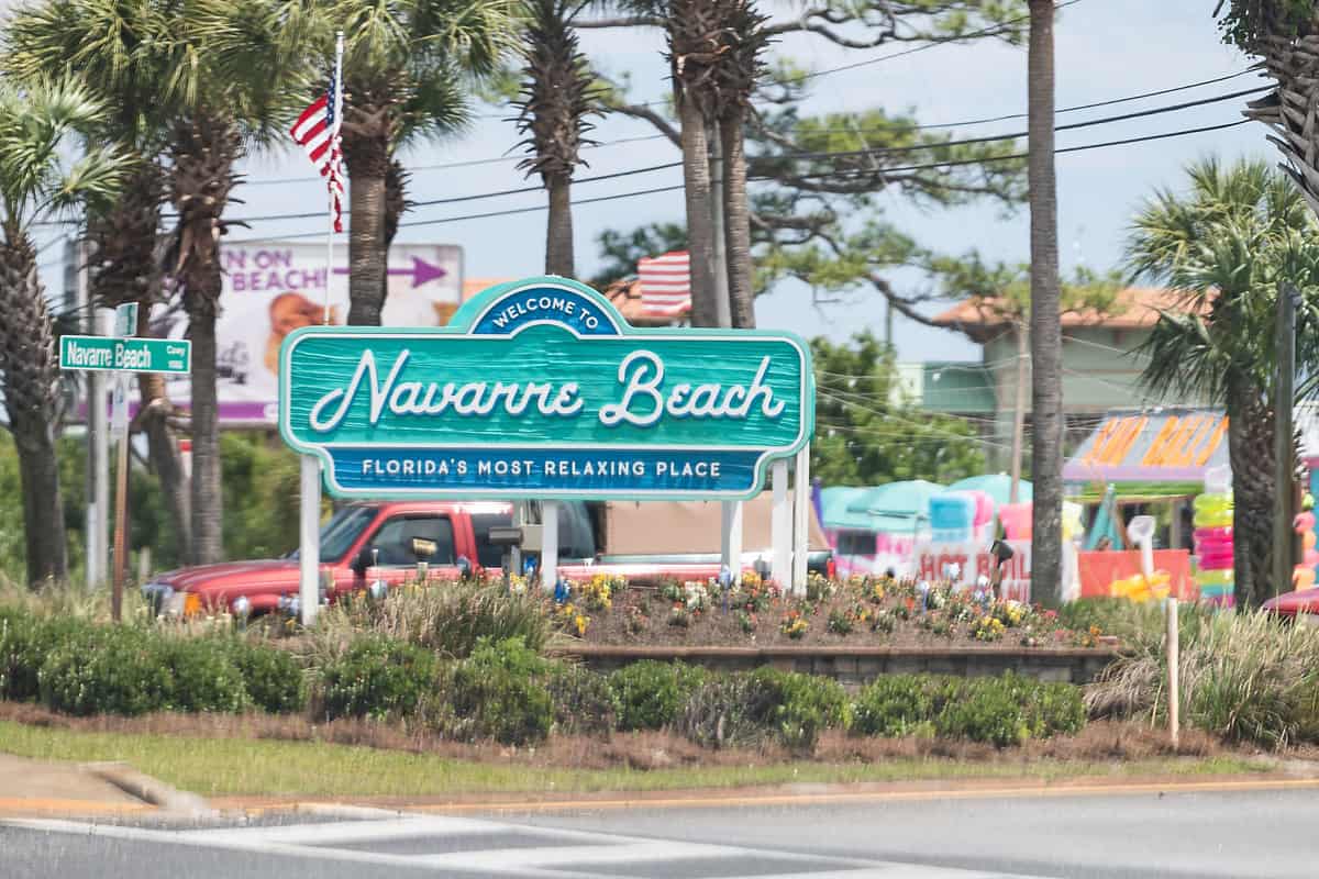 A sign showing Navarre beach in Florida