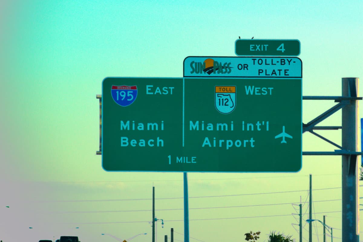 South Florida's Miami Beach landmark and Miami International Airport green interstate 195 highway exit sign