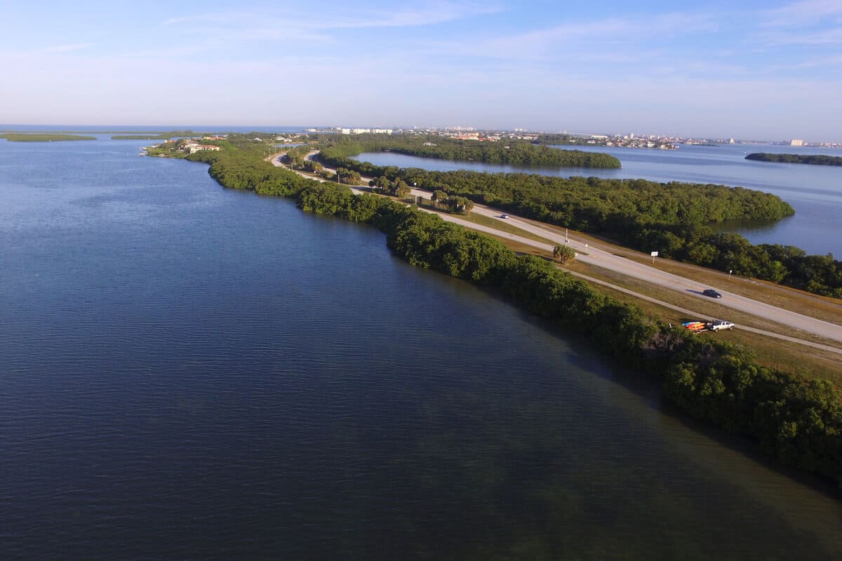 A drone aerial image of the Pinellas Bayway road that connects Tierra Verde with Fort DeSoto Park in Tampa Bay. The mangrove lined roadway is a popular area for fishing, kayaking and bird watching
