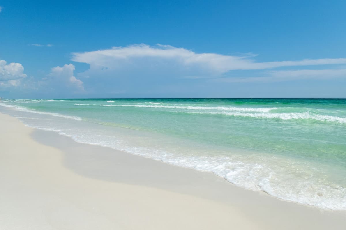Blue skies, white sands and green waters on Florida’s Emerald Coast near Henderson Beach State Park and Destin Florida
