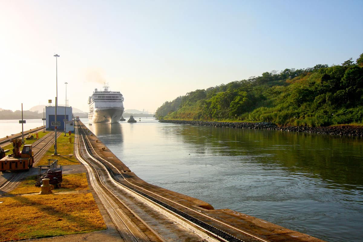Cruise ship enters the Miraflores lock in the Panama Canal. Early morning on a beautiful sunny day in Panama.
