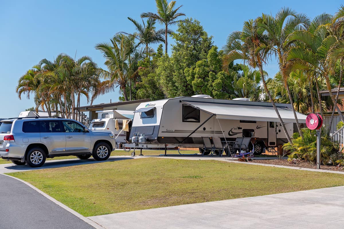 RVs are parked at El Mar RV Resort - An Upscale Island Retreat.