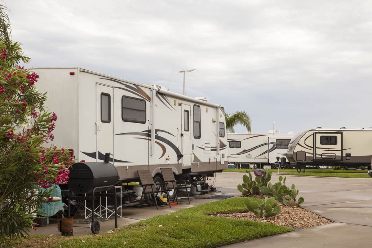 RVs are parked at Leo's Campground - Where affordable comfort awaits.