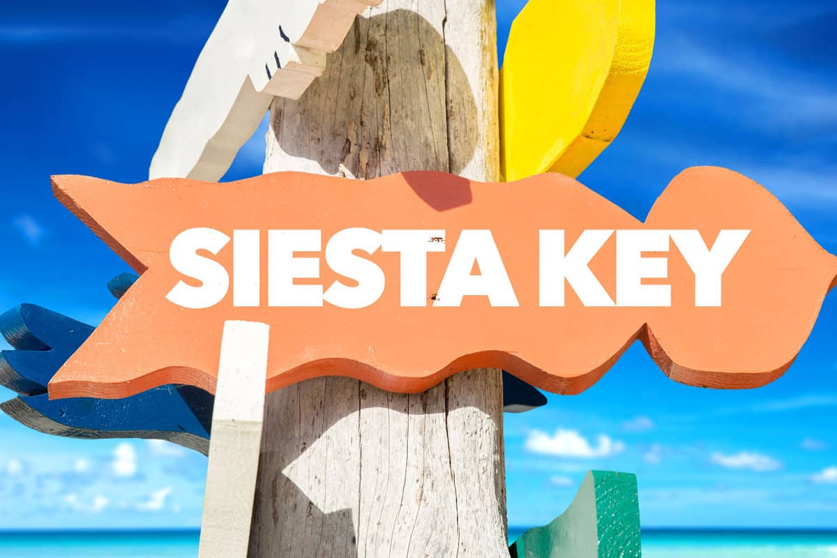 Siesta Key welcome sign with beach
